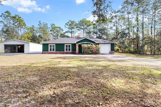 ranch-style home featuring a garage and a front yard