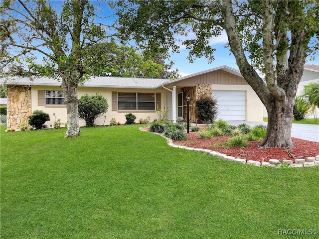 single story home with a garage and a front yard