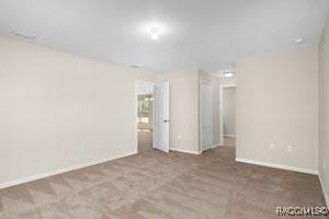 empty room with carpet flooring