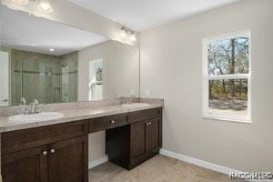 bathroom with vanity and an enclosed shower