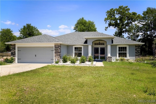 11609 SW 59th Ter, Ocala, FL 34476 - view of front of property featuring french doors, an attached garage, concrete driveway, a front lawn, and stucco siding