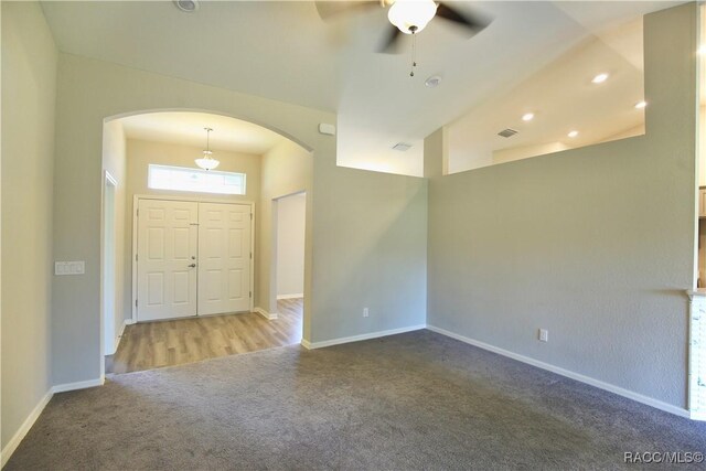 11609 SW 59th Ter, Ocala, FL 34476 - foyer with arched walkways, carpet flooring, ceiling fan, baseboards, and recessed lighting