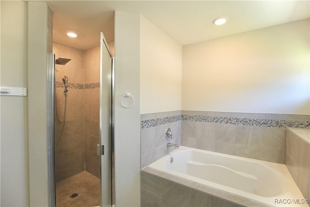 11609 SW 59th Ter, Ocala, FL 34476 - bathroom featuring a stall shower, a bath, and recessed lighting