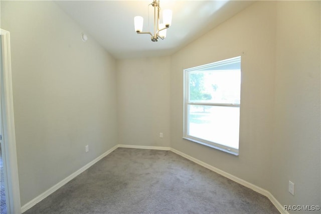11609 SW 59th Ter, Ocala, FL 34476 - empty room featuring a chandelier, carpet floors, and baseboards