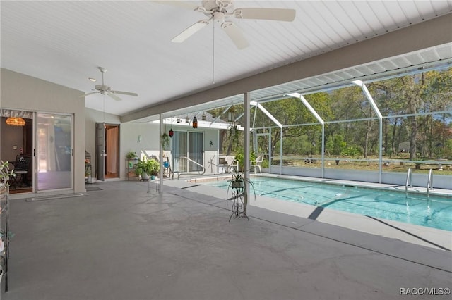 outdoor pool with a lanai, ceiling fan, and a patio