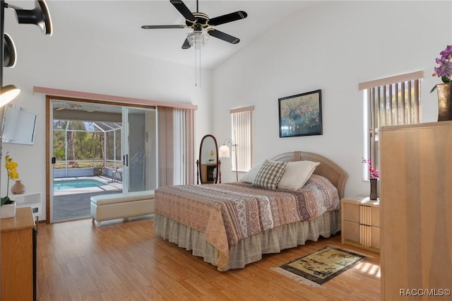 bedroom with light wood-type flooring, high vaulted ceiling, ceiling fan, and access to outside