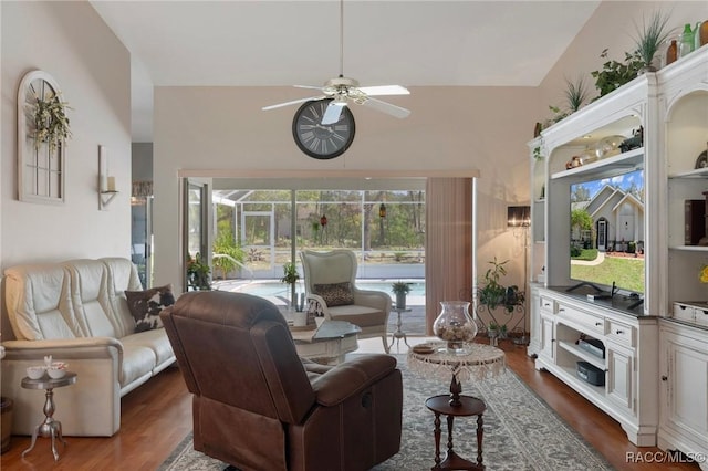 living room with dark wood-style floors and ceiling fan