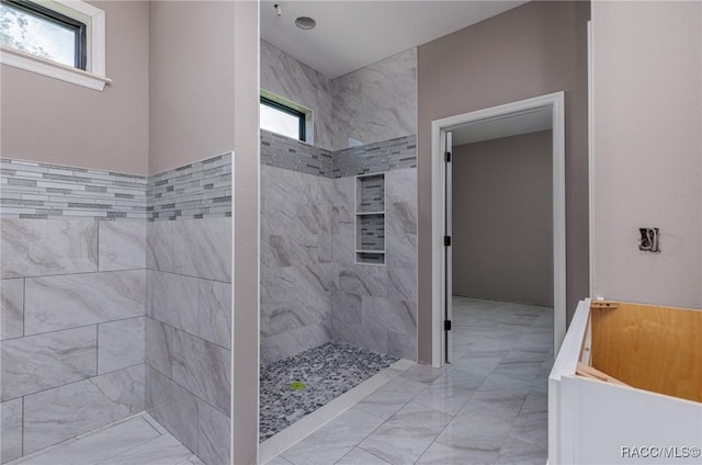 5898 N Flagstaff Ave, Beverly Hills, FL 34465 - full bath with a walk in shower, marble look tiles, and a tub to relax in