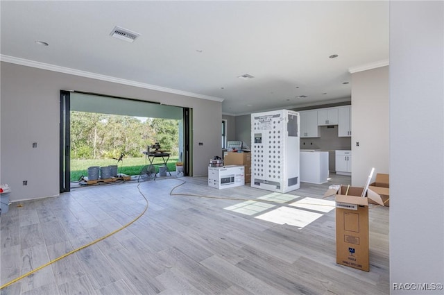 5898 N Flagstaff Ave, Beverly Hills, FL 34465 - living area featuring ornamental molding and light wood-style flooring