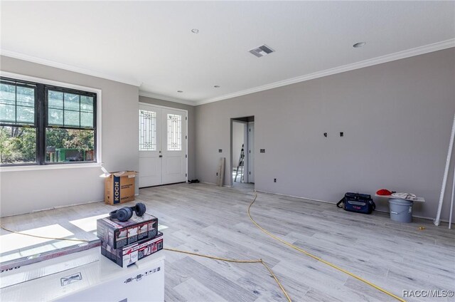 5898 N Flagstaff Ave, Beverly Hills, FL 34465 - entryway with ornamental molding and light wood finished floors