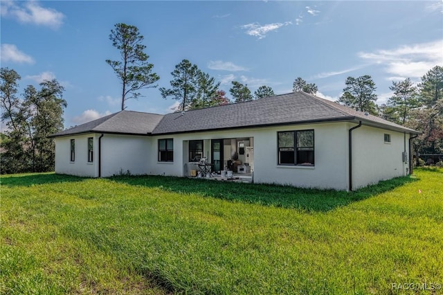 5898 N Flagstaff Ave, Beverly Hills, FL 34465 - rear view of house with a yard and stucco siding