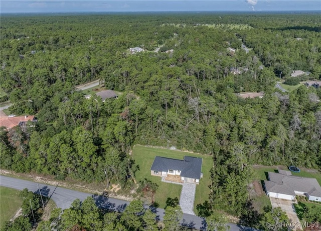 5898 N Flagstaff Ave, Beverly Hills, FL 34465 - aerial view of property and surrounding area featuring a heavily wooded area