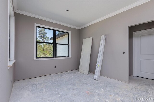 5898 N Flagstaff Ave, Beverly Hills, FL 34465 - unfurnished bedroom featuring crown molding