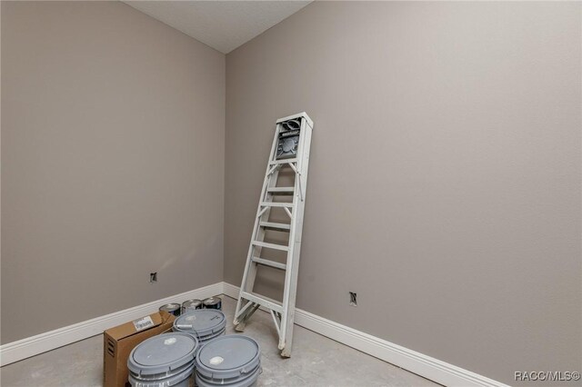 5898 N Flagstaff Ave, Beverly Hills, FL 34465 - spare room with baseboards and unfinished concrete flooring