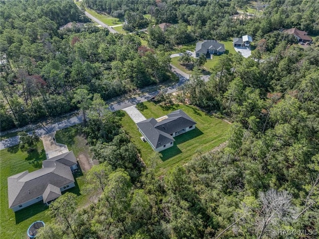 5898 N Flagstaff Ave, Beverly Hills, FL 34465 - aerial view of property and surrounding area with a heavily wooded area