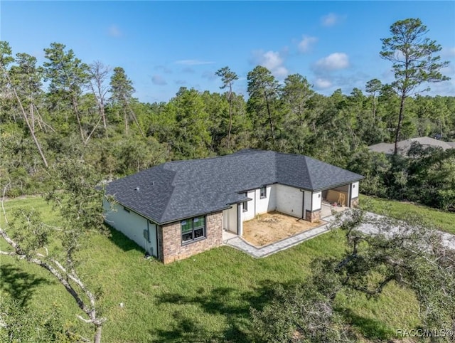 5898 N Flagstaff Ave, Beverly Hills, FL 34465 - view from above of property with a heavily wooded area