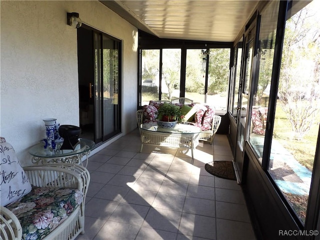 sunroom with wooden ceiling