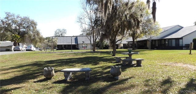 view of home's community with a yard