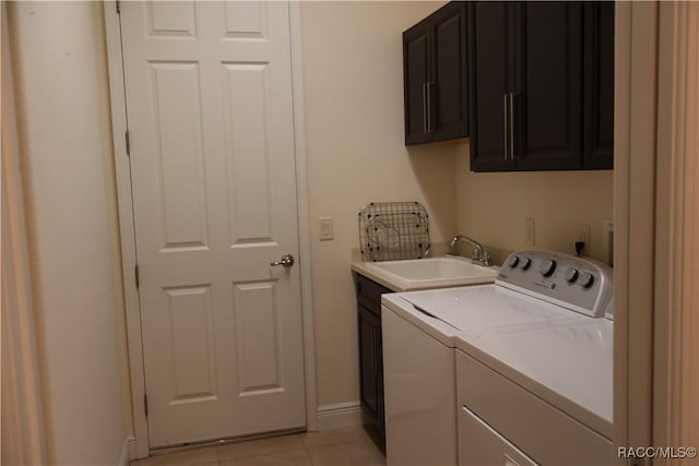 1366 N Bellamy Pt, Hernando, FL 34442 - washroom with cabinet space, light tile patterned flooring, a sink, separate washer and dryer, and baseboards