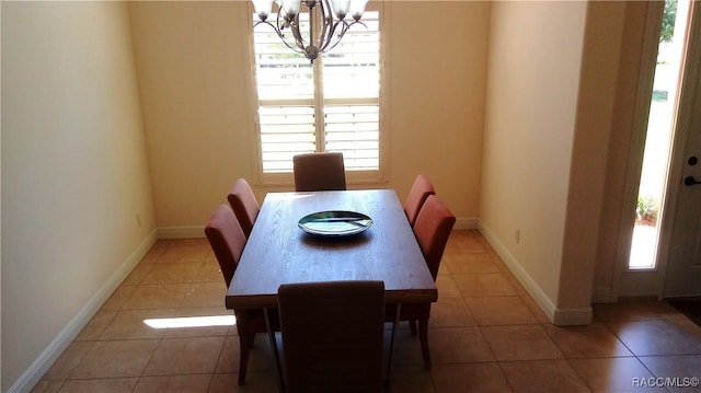 1366 N Bellamy Pt, Hernando, FL 34442 - dining area with baseboards, a chandelier, and tile patterned flooring