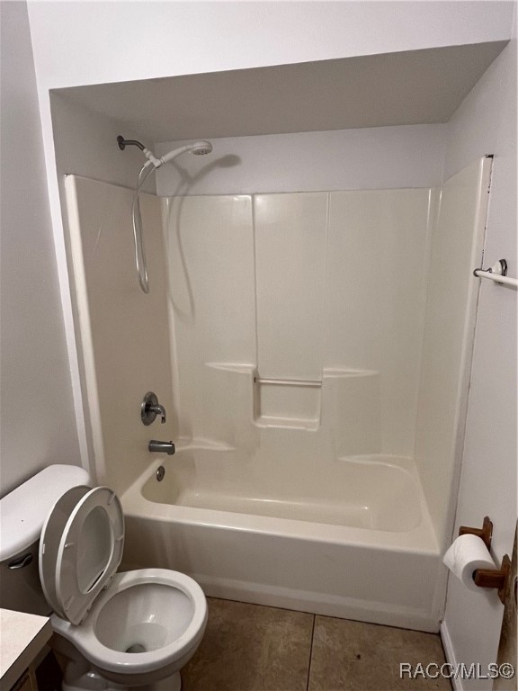 full bathroom with tile patterned floors, vanity, toilet, and shower / tub combination