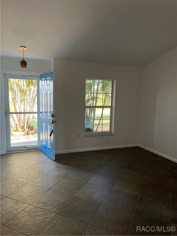 spare room with a wealth of natural light