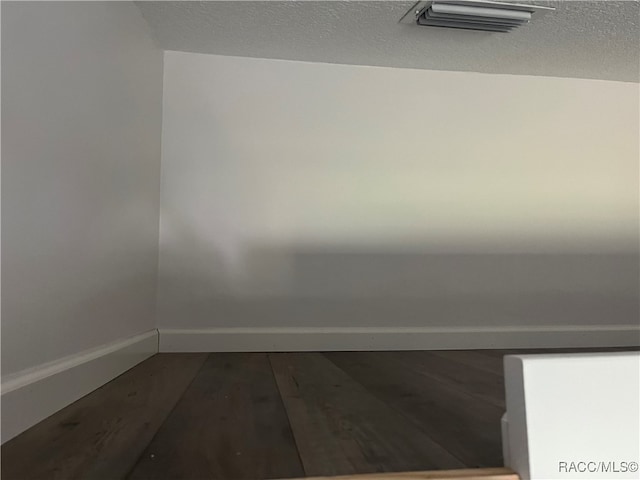 spare room with hardwood / wood-style flooring