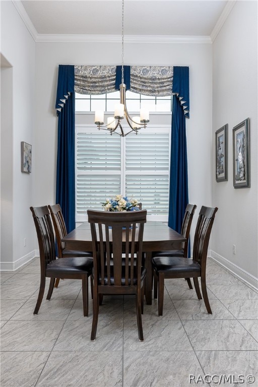 dining room featuring ornamental molding and an inviting chandelier