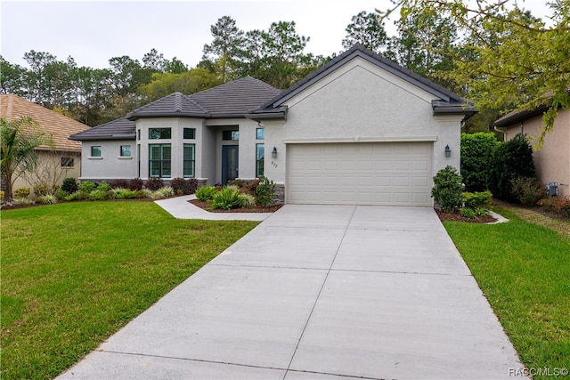 view of front facade featuring a front lawn and a garage