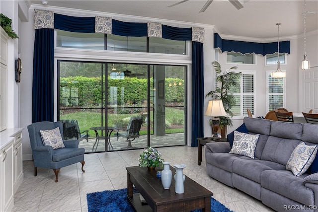 living room featuring ceiling fan and ornamental molding