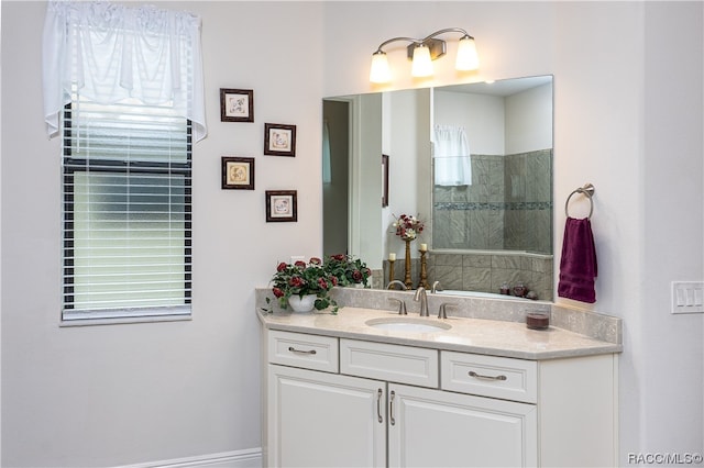 bathroom with a shower and vanity