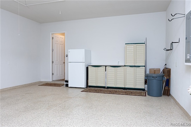 garage with white refrigerator