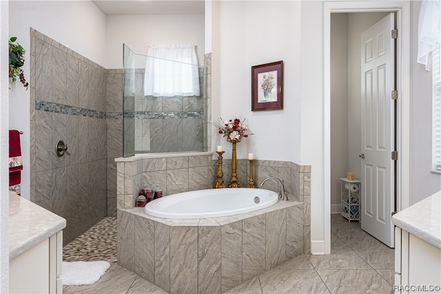 bathroom with separate shower and tub and vanity