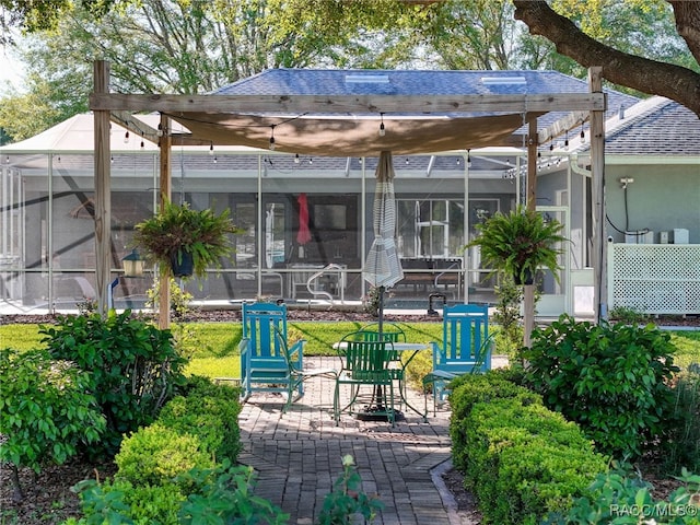 view of patio / terrace featuring glass enclosure