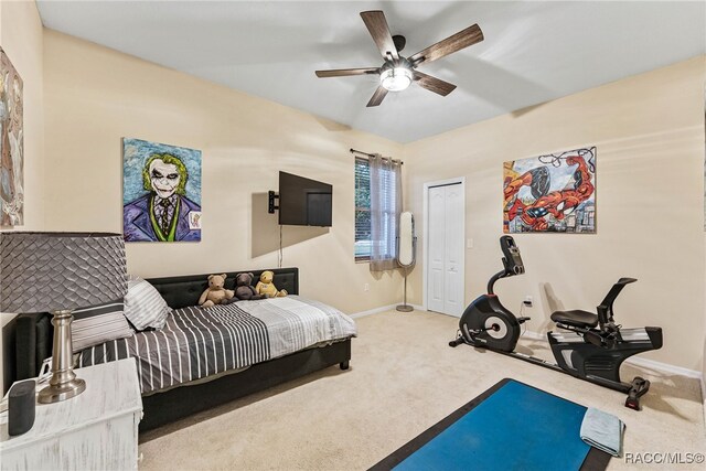 carpeted bedroom featuring baseboards, a ceiling fan, and a closet