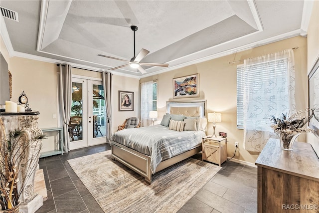 bedroom with french doors, visible vents, a raised ceiling, ornamental molding, and access to outside
