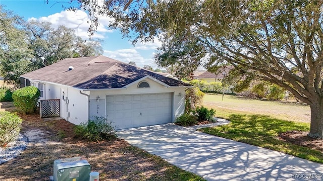 exterior space featuring a garage and a yard