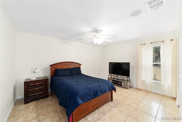 tiled bedroom featuring ceiling fan