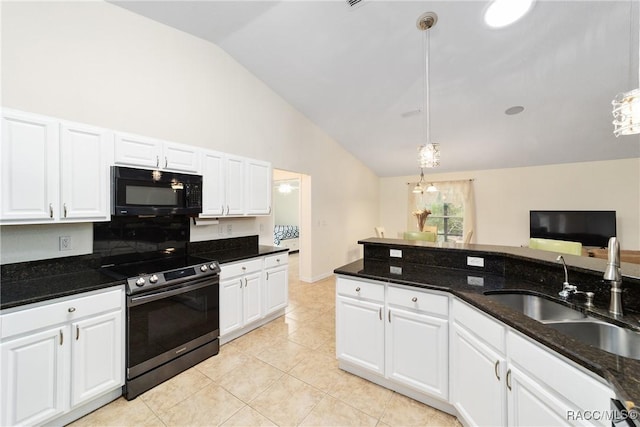 kitchen with stainless steel electric stove, sink, dark stone countertops, white cabinets, and hanging light fixtures