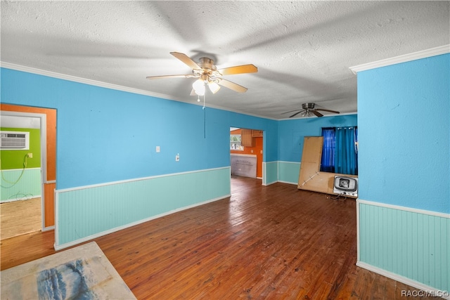 unfurnished living room with a textured ceiling, heating unit, a wall mounted air conditioner, and dark hardwood / wood-style floors