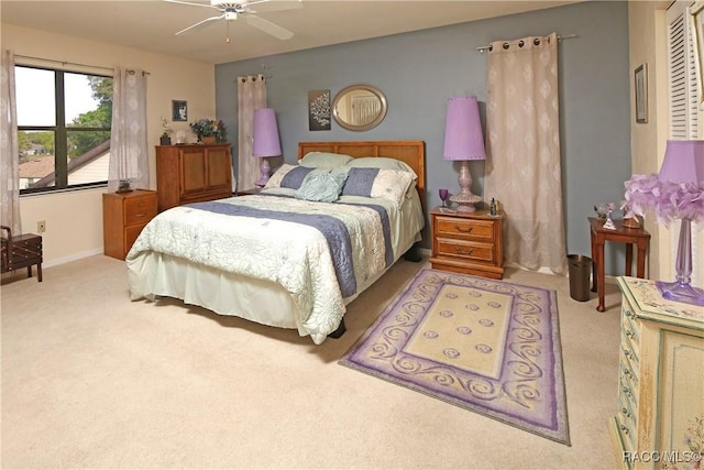 bedroom with light colored carpet and ceiling fan