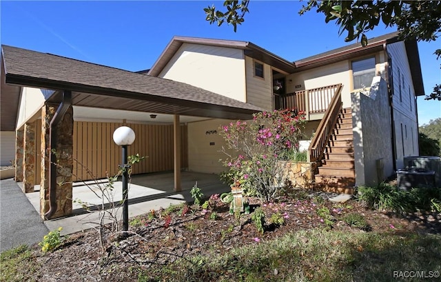 back of property featuring a carport