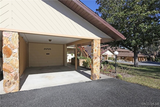 exterior space with a carport