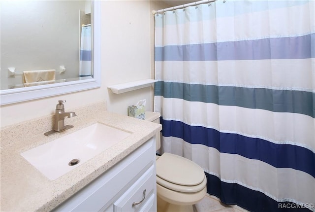 bathroom with toilet and vanity