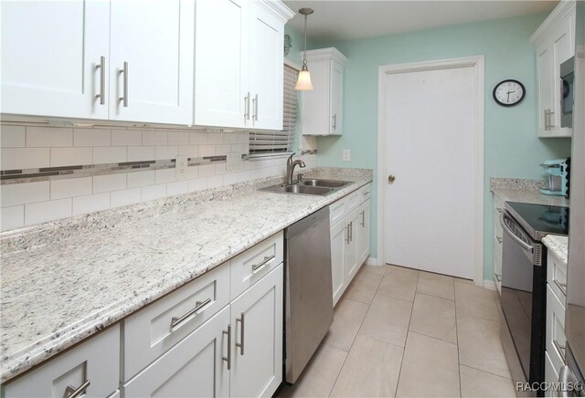 kitchen featuring sink, dishwasher, electric range oven, hanging light fixtures, and white cabinets