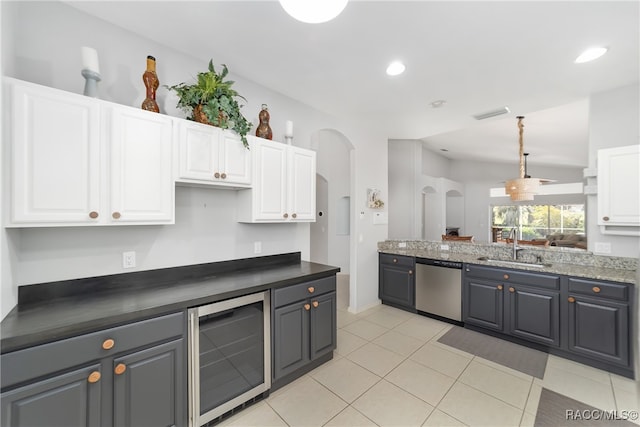 kitchen featuring stainless steel dishwasher, sink, white cabinets, gray cabinets, and wine cooler