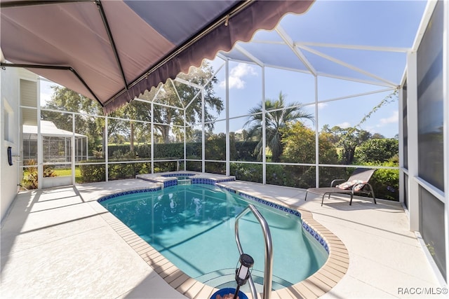 view of pool with a patio and a lanai