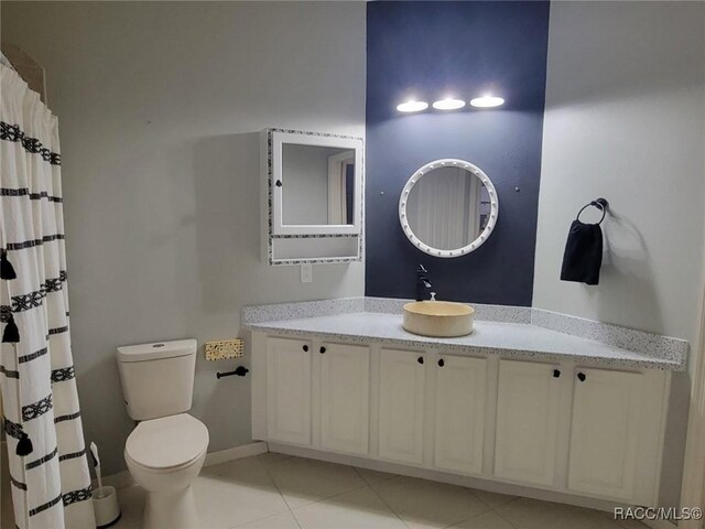 902 W Silver Meadow Loop, Hernando, FL 34442 - bathroom with vanity, toilet, tile patterned flooring, and a shower with shower curtain