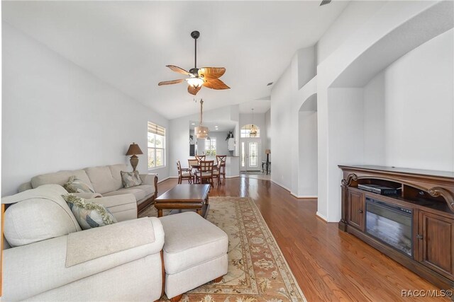 902 W Silver Meadow Loop, Hernando, FL 34442 - living room featuring vaulted ceiling, a ceiling fan, wood finished floors, and baseboards