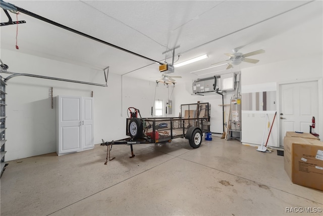 garage with electric panel, gas water heater, a garage door opener, and ceiling fan